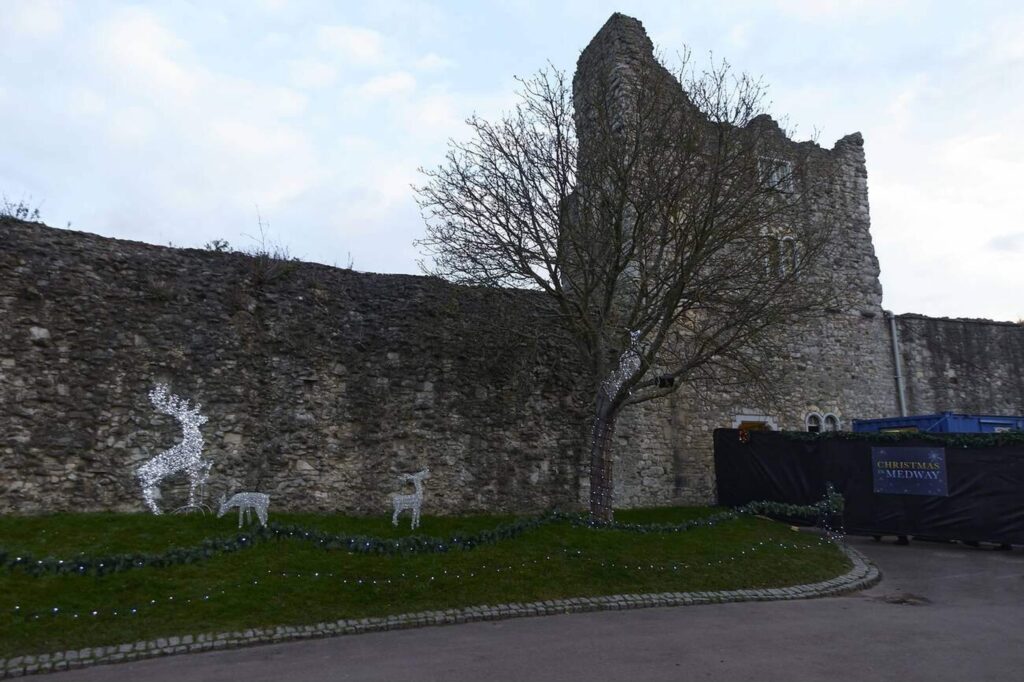 Photo of Rochester castle wall showing Christmas deer lights